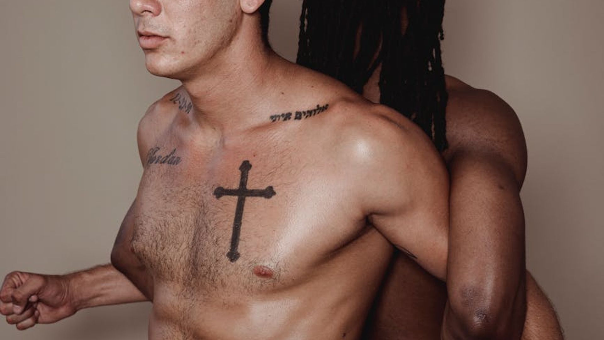 Man performing a controlled strength exercise in a minimalist gym setting.