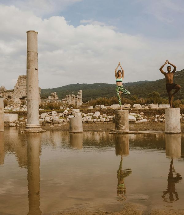 Silhouette of a man stretching against a sunrise, symbolizing progress and well-being.